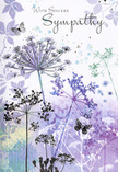 This sympathy card reads like a gentle visual poem, shaped by nature and hushed emotion, the way a quiet corner of Hanwell might feel at dusk. Airy silhouettes of wildflowers stretch upward across the card, their stems fine and slightly curved, as though reaching instinctively for light. The blossoms form delicate umbels, rendered in graceful shades of lavender, indigo, and soft blue that blend into one another in transparent layers. Behind them, the background is a dreamy wash of muted purples, powdery blues, and hints of soft grey-green, suggesting a meadow fading into evening light near the outskirts of the Brent Valley. The impression of pale petals and faint foliage drifts across this backdrop, adding a soft texture that never dominates, only enhances the sense of depth. Here and there, butterflies hover close to the blossoms, their wings ghosted in gentle colour, evoking transformation, remembrance, and the quiet presence of those no longer seen but still deeply felt. The palette is cool yet comforting, calming the eye and soothing the spirit, like the stillness that comes after heartfelt tears. Across this serene scene, the words With Sincere Sympathy are written in elegant script, their curve echoing the arc of the flower stems. The lettering is clear but not loud, a respectful murmur rather than a proclamation. Every detail feels considered, as though a florist-friend in Hanwell had chosen each element to wrap the recipient in understated warmth and solace, offering a respectful embrace crafted from nature's own reassuring language.